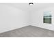 A light-filled bedroom features neutral walls, carpet, and a bright window at 88 Mable Court # 17, Lillington, NC 27546