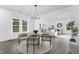 Sun-filled dining room flows seamlessly into the living area, offering a welcoming space for gatherings and entertaining at 88 Mable Court # 17, Lillington, NC 27546