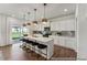 Modern kitchen with white cabinets, stainless steel appliances, and a large center island with seating at 88 Mable Court # 17, Lillington, NC 27546