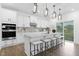A stunning kitchen features stainless appliances, quartz countertops, subway tile backsplash, and island with seating at 88 Mable Court # 17, Lillington, NC 27546