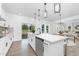 A spacious kitchen with stainless appliances, quartz countertops, and access to the backyard through sliding doors at 88 Mable Court # 17, Lillington, NC 27546
