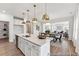 Kitchen with an island, dining area, and a view into the living room at 88 Mable Court # 17, Lillington, NC 27546