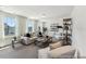 An open-concept living room with modern furnishings, neutral color palette, and lots of natural light at 88 Mable Court # 17, Lillington, NC 27546