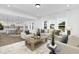 Open-concept living room with seamless flow to the kitchen, featuring comfortable seating and stylish accents at 88 Mable Court # 17, Lillington, NC 27546