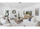 Inviting living room with a cozy seating area, modern entertainment center, and elegant decor for relaxation at 88 Mable Court # 17, Lillington, NC 27546