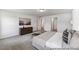 Comfortable bedroom with a large bed, soft carpet, and a dresser for storage and decor at 88 Mable Court # 17, Lillington, NC 27546