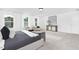 Well-lit main bedroom featuring a comfortable bed, seating, and stylish decor for a relaxing retreat at 88 Mable Court # 17, Lillington, NC 27546