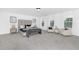 Spacious main bedroom featuring a luxurious bed, sitting area, and ample natural light from large windows at 88 Mable Court # 17, Lillington, NC 27546