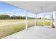 Screened porch showcasing an outdoor living space with views of the backyard at 88 Mable Court # 17, Lillington, NC 27546