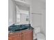 Bathroom featuring dark green countertops, a toilet, and a bathtub/shower combo at 9211 Calabria Dr # 104, Raleigh, NC 27617