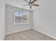 Neutral bedroom featuring carpet flooring, bright natural light, and community views at 9211 Calabria Dr # 104, Raleigh, NC 27617