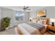 Bright bedroom with ceiling fan, natural light, and a double bed at 9211 Calabria Dr # 104, Raleigh, NC 27617