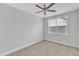 Bedroom with a ceiling fan and window offering plenty of natural light at 9211 Calabria Dr # 104, Raleigh, NC 27617