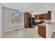 The kitchen area boasts lots of sunlight, a dining area, and modern appliances at 9211 Calabria Dr # 104, Raleigh, NC 27617