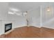 Open living area with hardwood floors, a fireplace, and seamless transitions to other spaces, ideal for modern living at 9211 Calabria Dr # 104, Raleigh, NC 27617