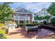 Community outdoor patio with grill, fire pit, and seating for social gatherings at 9211 Calabria Dr # 104, Raleigh, NC 27617