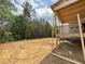 Large new construction backyard space with a backdrop of trees at 93 Bur Oak Ct, Pittsboro, NC 27312