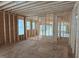 Construction framing of a room features exposed beams and a view to the exterior, showing the home's build at 93 Bur Oak Ct, Pittsboro, NC 27312