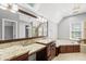 Luxurious bathroom featuring dual vanities, a soaking tub, and a skylight at 1007 Surry Dale Ct, Apex, NC 27502
