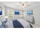 Staged bedroom featuring soft lighting, ocean themed artwork, and coordinated furniture at 1007 Surry Dale Ct, Apex, NC 27502