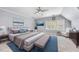 Serene bedroom featuring neutral tones, plush bedding, and ample natural light at 1007 Surry Dale Ct, Apex, NC 27502
