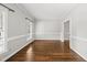 Neutral dining room featuring hardwood flooring and classic window trim and molding at 1007 Surry Dale Ct, Apex, NC 27502