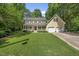 Inviting two-story home with well-maintained lawn, attached garage, and a classic American aesthetic at 1007 Surry Dale Ct, Apex, NC 27502