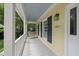 Charming front porch featuring a swing, providing a cozy spot to relax and enjoy the outdoors at 1007 Surry Dale Ct, Apex, NC 27502