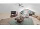 Spacious living room in bonus area with comfortable seating, coffee table, and television for relaxed entertainment at 1007 Surry Dale Ct, Apex, NC 27502