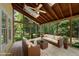 Inviting screened porch with comfortable seating and a serene view of the surrounding greenery at 1007 Surry Dale Ct, Apex, NC 27502