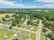 An aerial of the neighborhood with lush green trees at 102 Pine St, Dunn, NC 28334