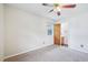 This bedroom features a ceiling fan and adjoins a partial bathroom at 102 Pine St, Dunn, NC 28334