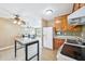 Cozy kitchen features standard appliances, tile backsplash, and easy access to dining area at 102 Pine St, Dunn, NC 28334