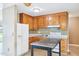 Classic kitchen design with wooden cabinets, standard appliances, and neutral countertops at 102 Pine St, Dunn, NC 28334