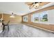 Spacious living room featuring large windows, stylish flooring, and ample natural light at 102 Pine St, Dunn, NC 28334