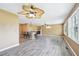 Open-concept living area with modern flooring, fireplace, and comfortable bar seating at 102 Pine St, Dunn, NC 28334