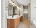 Bright bathroom featuring a double vanity with sleek fixtures and a well-lit mirror at 105 Bagley Ln, Dunn, NC 28334