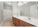Bathroom features a double vanity, shower and neutral tile flooring at 105 Bagley Ln, Dunn, NC 28334