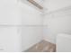 Empty walk-in closet features built-in shelving and carpet at 105 Bagley Ln, Dunn, NC 28334