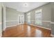Dining room with hardwood floors, chair rail, and views of the front yard at 105 Bagley Ln, Dunn, NC 28334