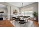 Bright dining room features an elegant light fixture and table set with black chairs at 105 Bagley Ln, Dunn, NC 28334