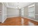 Inviting dining room featuring hardwood floors, a coffered ceiling, and ample natural light at 105 Bagley Ln, Dunn, NC 28334