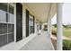 Spacious covered front porch with stately columns, offering ample space for relaxing and enjoying the outdoors at 105 Bagley Ln, Dunn, NC 28334