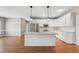 Modern kitchen featuring white cabinets, stainless steel appliances, and granite countertops at 105 Bagley Ln, Dunn, NC 28334