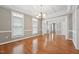 Spacious living room with hardwood floors, large windows, and elegant architectural details at 105 Bagley Ln, Dunn, NC 28334