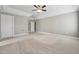 Large main bedroom with tray ceiling, neutral carpet, and ample closet space at 105 Bagley Ln, Dunn, NC 28334
