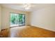 Bedroom with hardwood floors and sliding glass doors leading to a deck and scenic views at 106 Redbud, Pittsboro, NC 27312