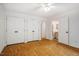Bright bedroom with hardwood floors, large closets, and access to an en suite bathroom at 106 Redbud, Pittsboro, NC 27312