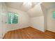Bedroom with hardwood floors, a window, and a ceiling fan at 106 Redbud, Pittsboro, NC 27312