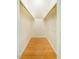 Walk-in closet with wood floors and custom shelving at 106 Redbud, Pittsboro, NC 27312